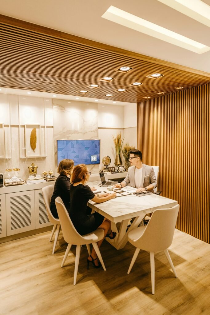 pexels photo 3285195 3285195 A group of professionals engaging in a meeting within a stylish office setting, fostering teamwork and cooperation.